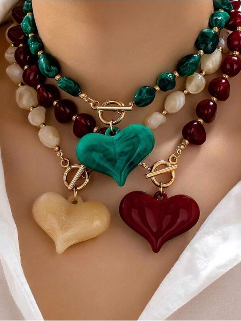Three-Strand Heart Pendant Necklace in Green, Red, and Cream